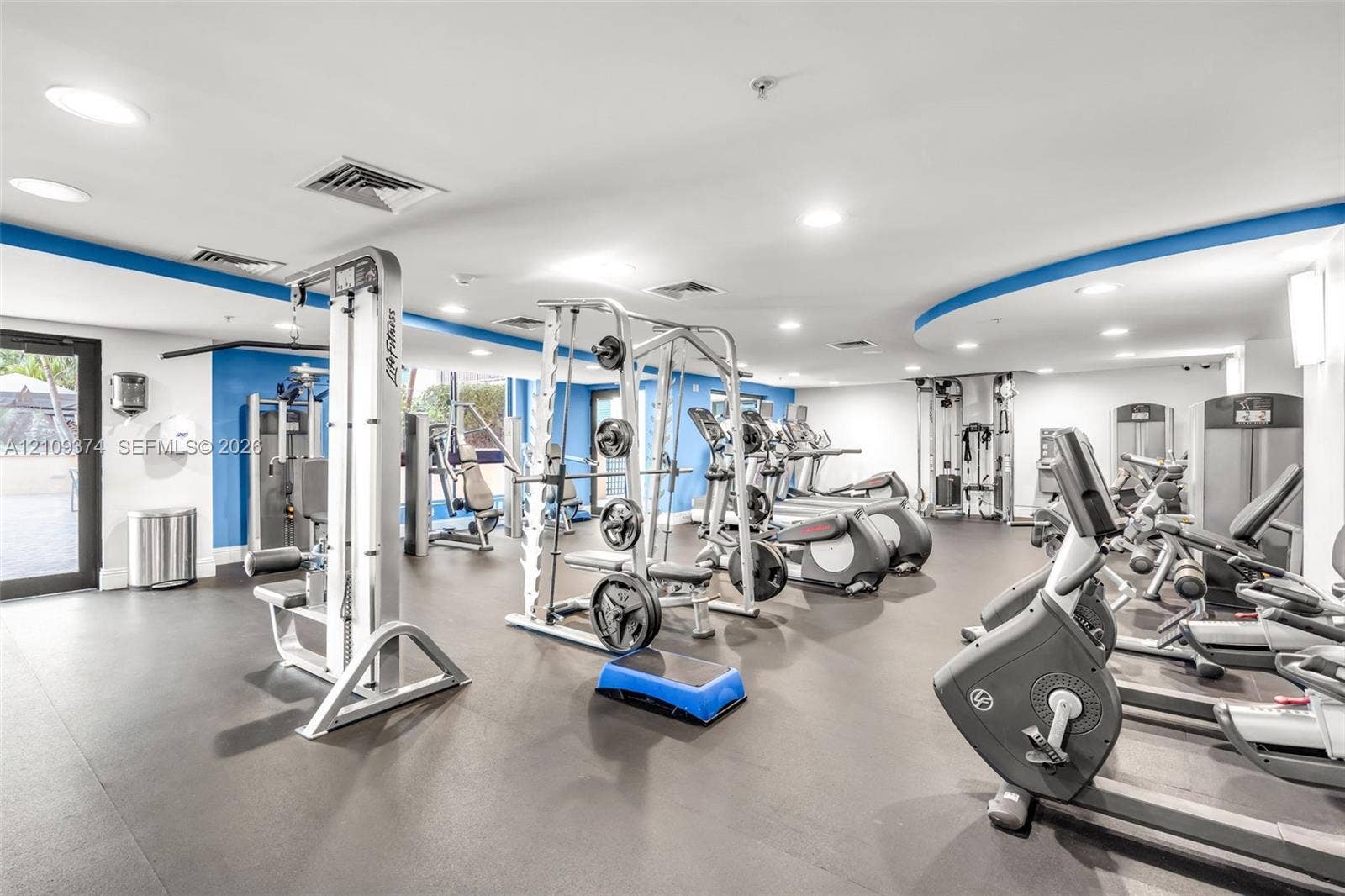 100 N Federal Highway, #1, Fort Lauderdale, FL 33301 Fitness center featuring recessed lighting, rubberized flooring, and an assortment of strength training and cardiovascular equipment