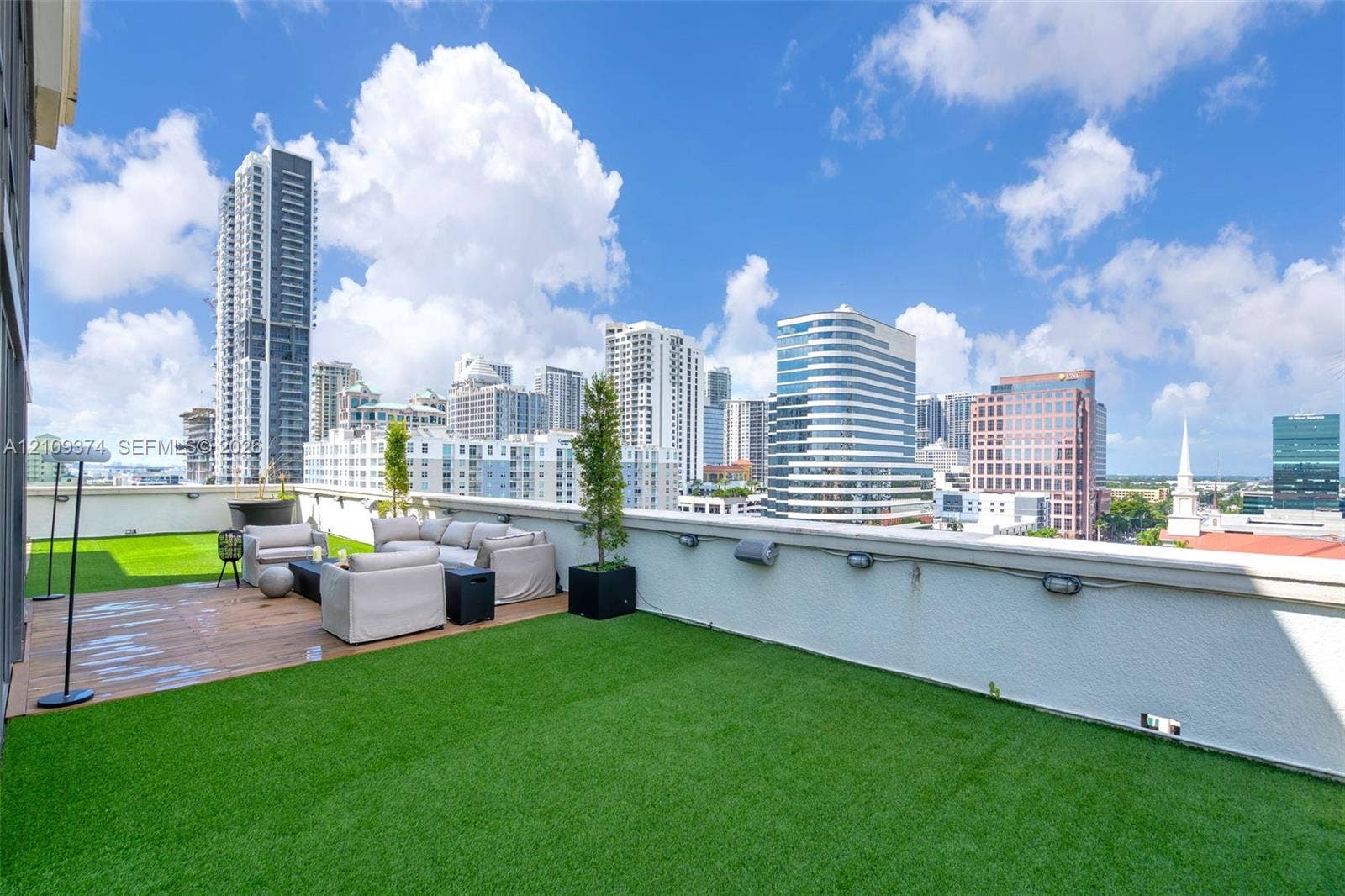 100 N Federal Highway, #1, Fort Lauderdale, FL 33301 Rooftop terrace featuring synthetic turf, wood-finish decking, and perimeter wall-mounted lighting