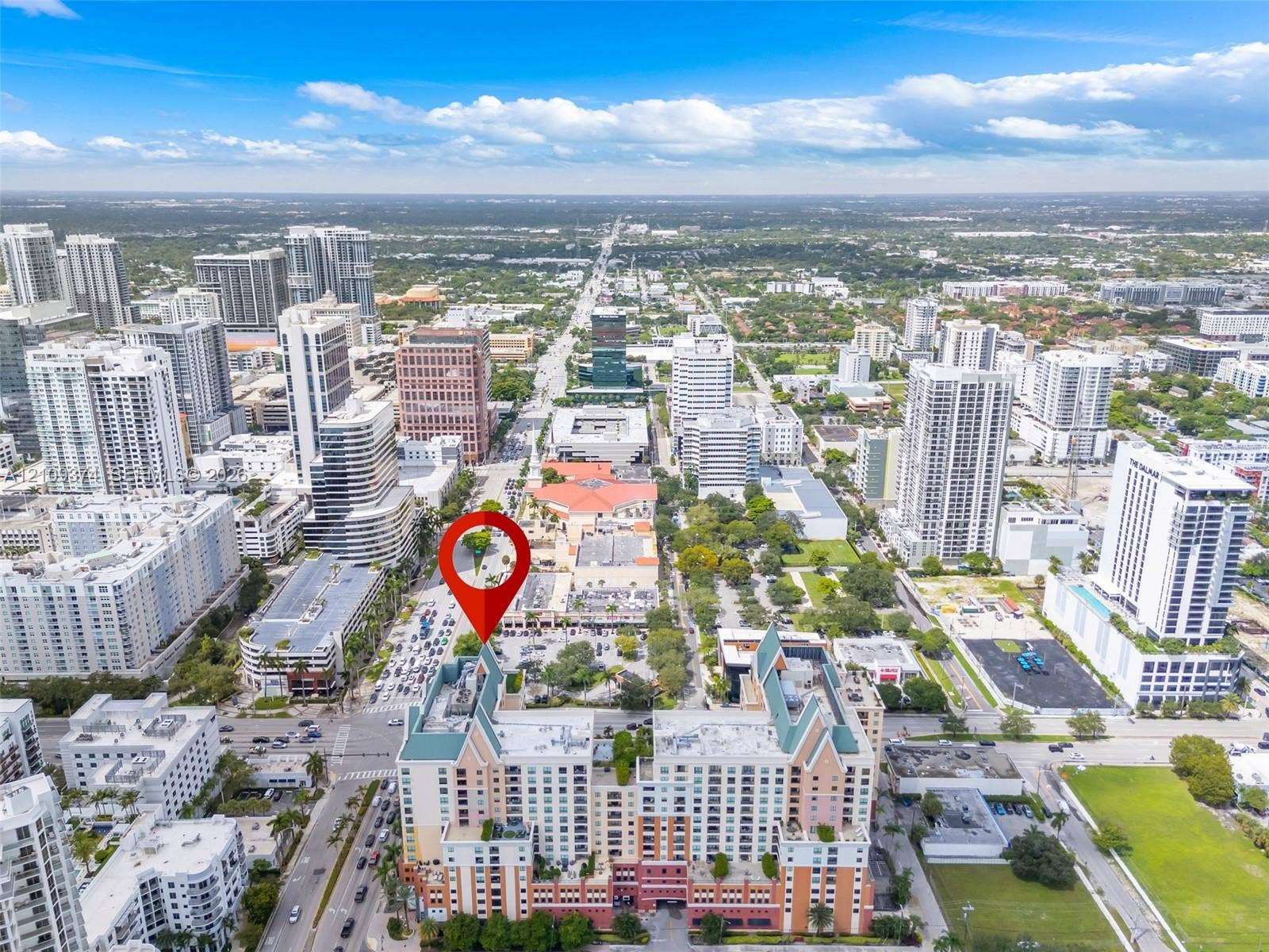 100 N Federal Highway, #1, Fort Lauderdale, FL 33301 Aerial perspective of a high-rise residential structure featuring a multi-level facade, pitched rooflines, and an integrated parking facility
