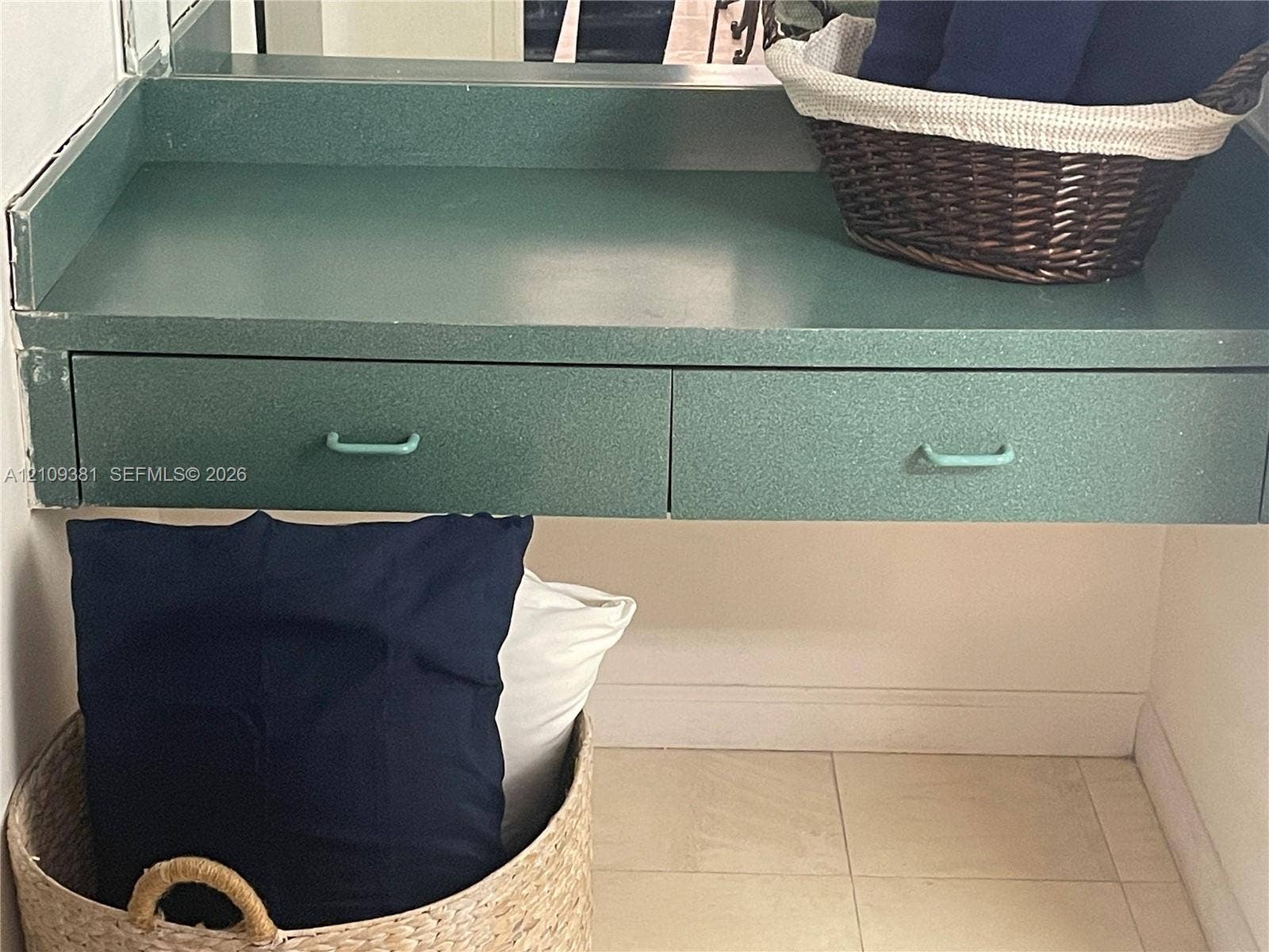 26 Diplomat Parkway, #2351, Hallandale Beach, FL 33009 Wall-mounted light fixture, mirror, and neutral countertop