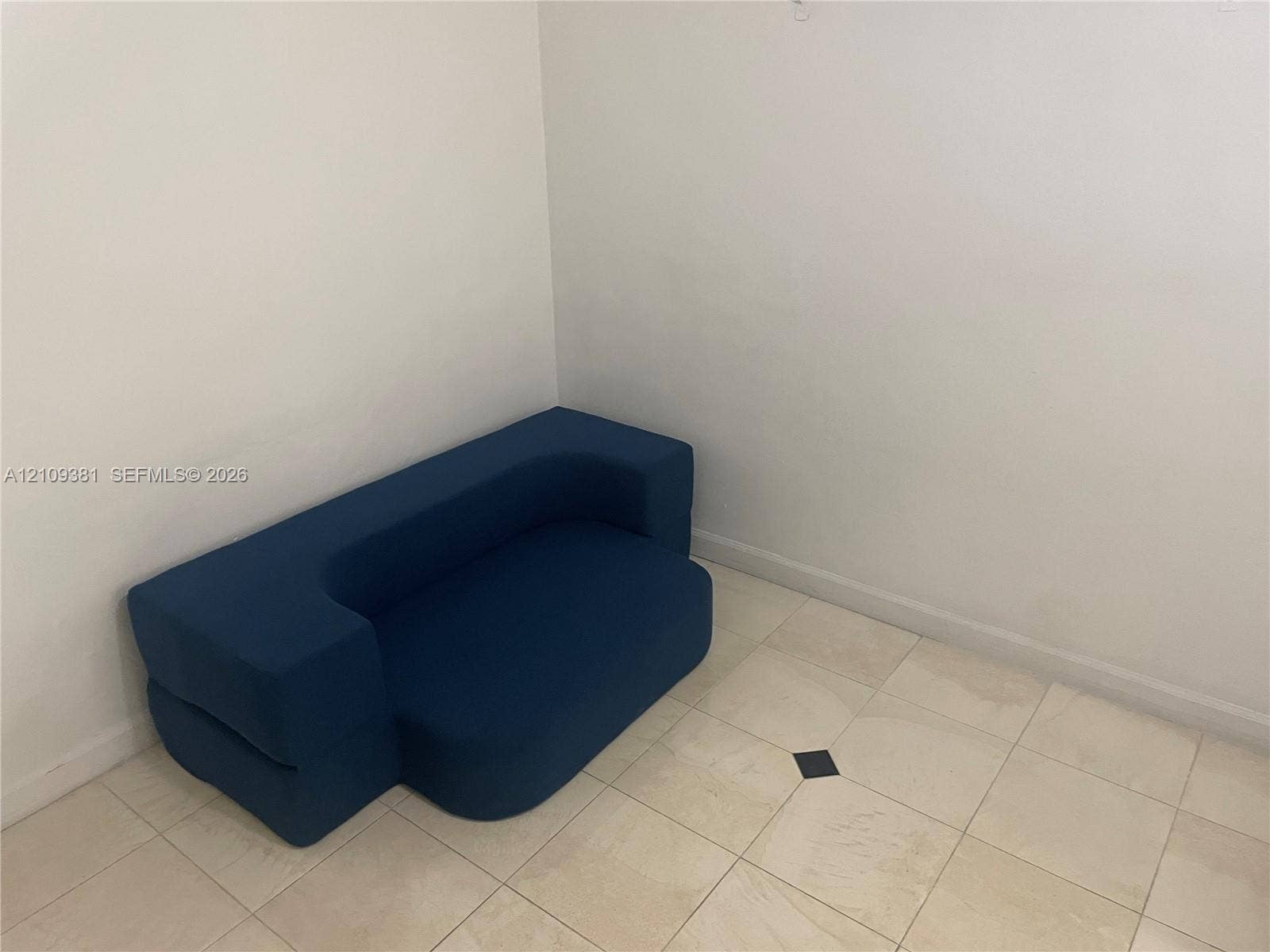 26 Diplomat Parkway, #2351, Hallandale Beach, FL 33009 Built-in bar featuring a stone-finish countertop and tile flooring