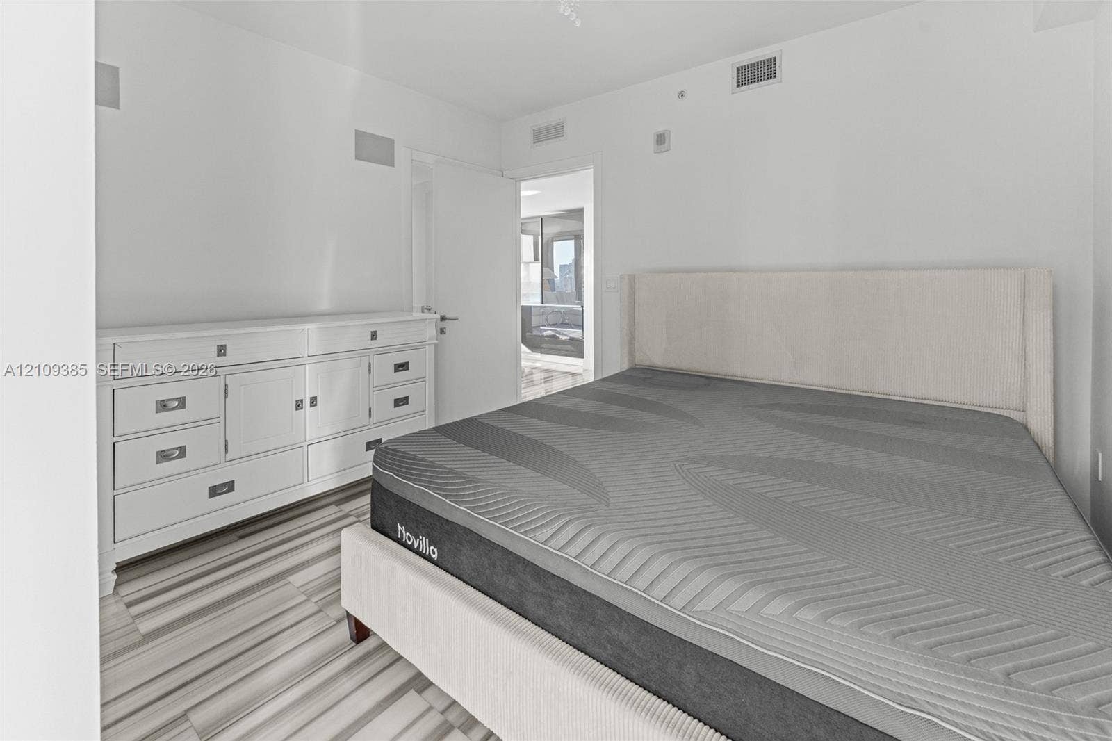 Interior space featuring wood-finish flooring and neutral wall finishes