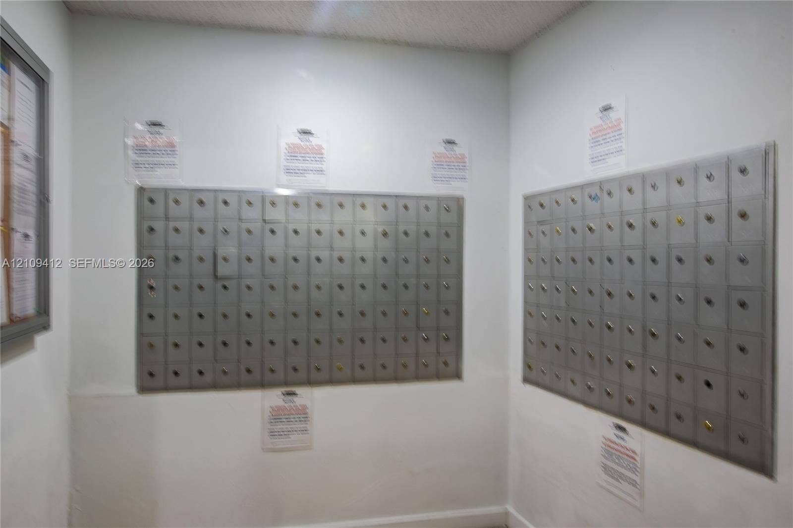 137 Golden Isles Drive, #408, Hallandale Beach, FL 33009 Dedicated mailroom featuring dual wall-mounted, multi-compartment metal postal banks with integrated key locks
