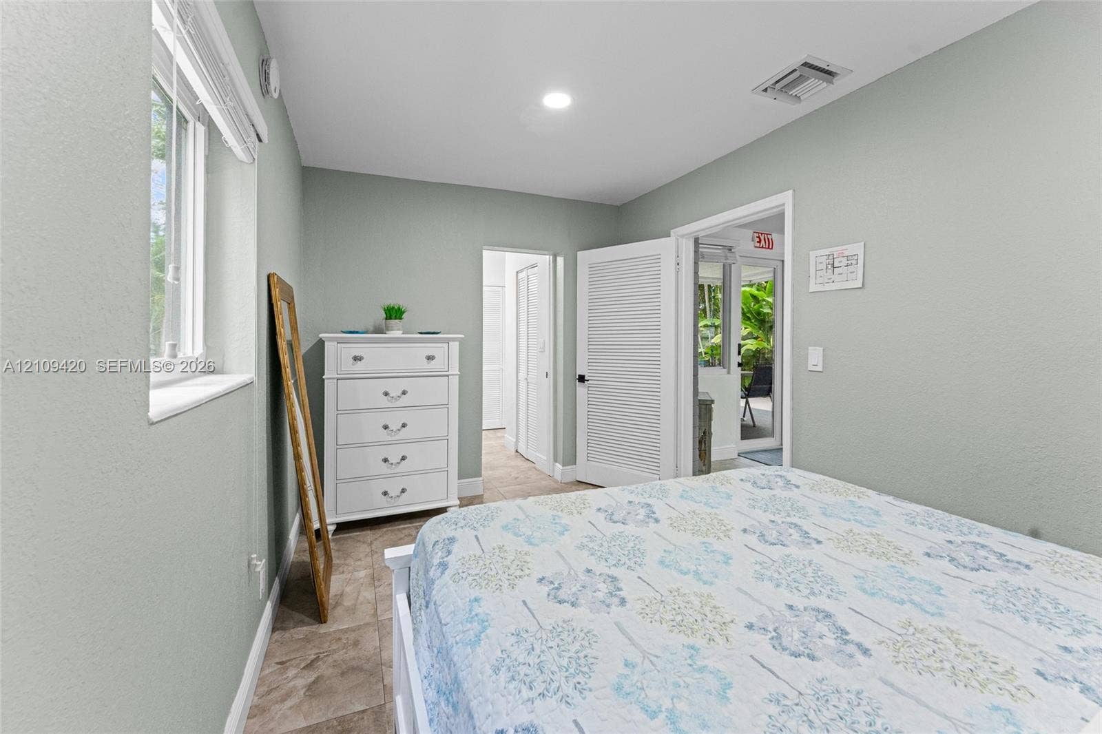 1955 Thomas Street, Hollywood, FL 33020 Room featuring tile flooring, neutral wall paint, a louvered closet door, and recessed lighting