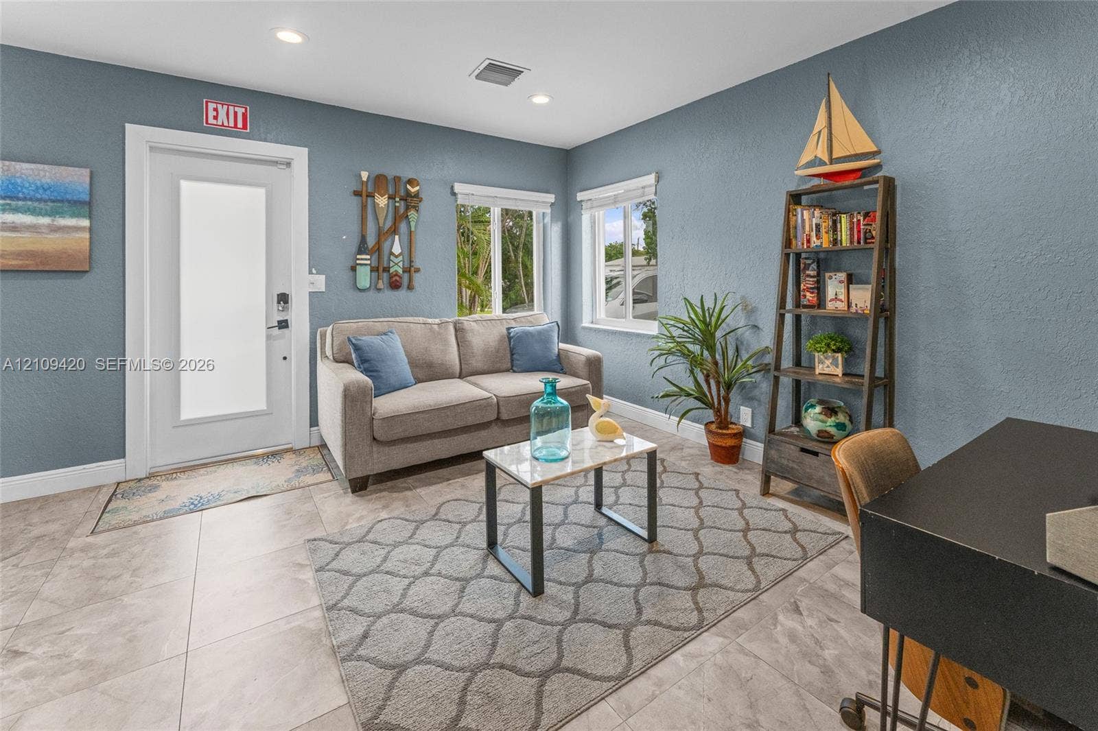 1955 Thomas Street, Hollywood, FL 33020 Neutral-toned ceramic tile flooring, recessed ceiling lighting, textured walls, and multi-pane windows