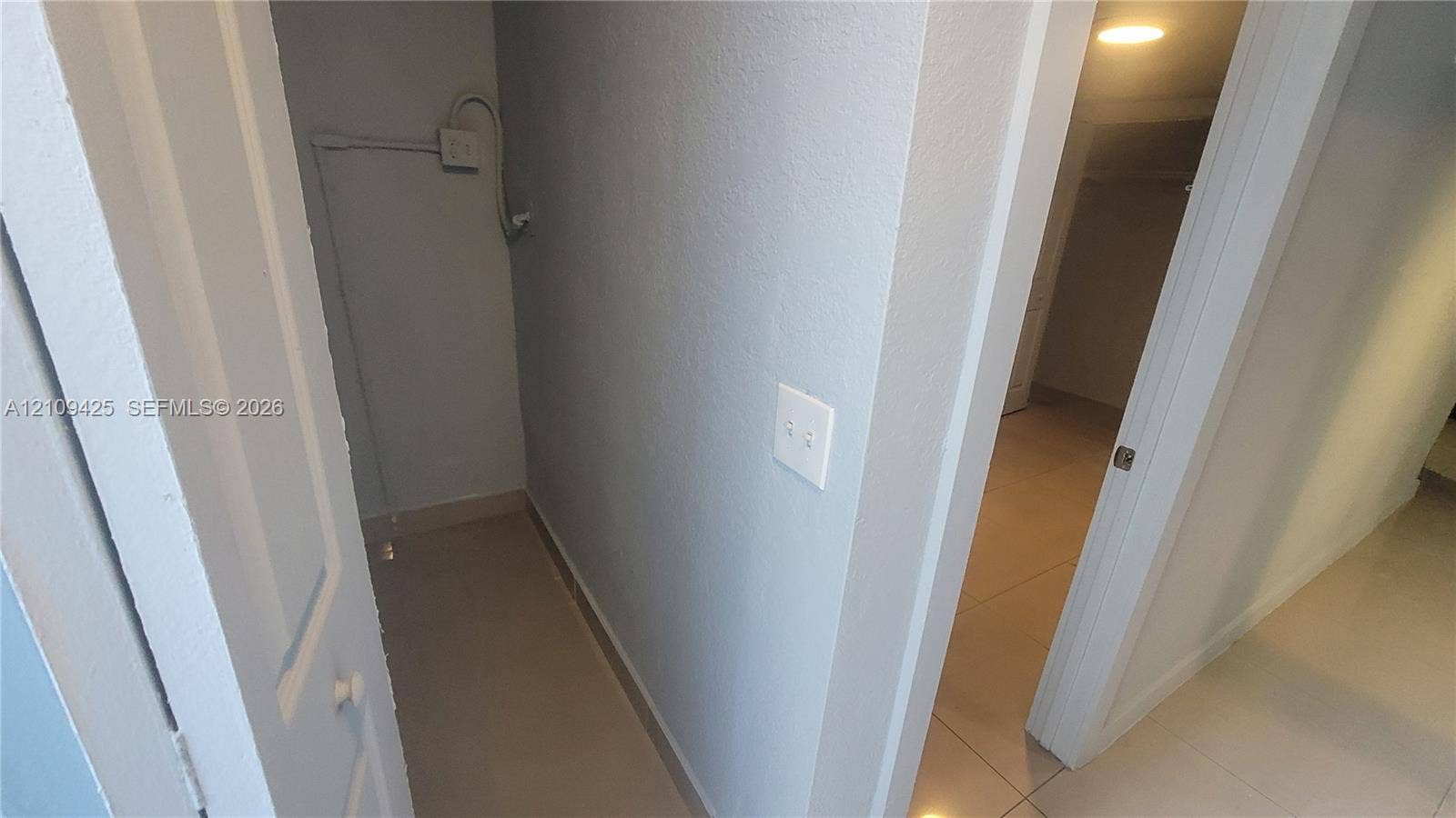 615 NW 25th Court, #B, Miami, Miami, FL 33125 Storage alcove featuring neutral wall finishes and oversized floor tile