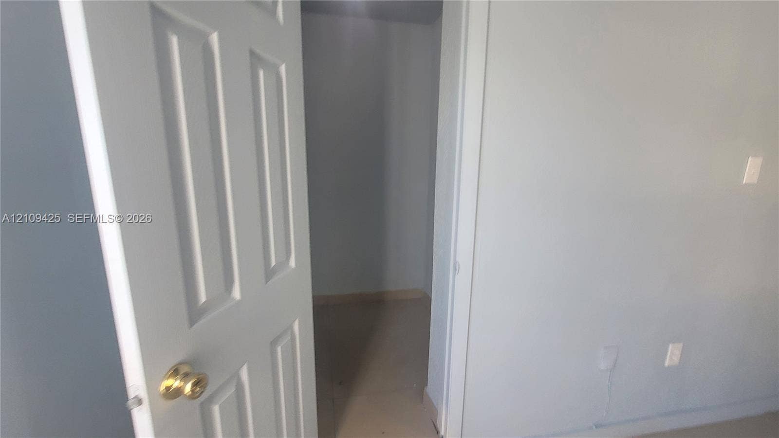 615 NW 25th Court, #B, Miami, Miami, FL 33125 Interior storage space featuring a panel door with a brass-finish round knob