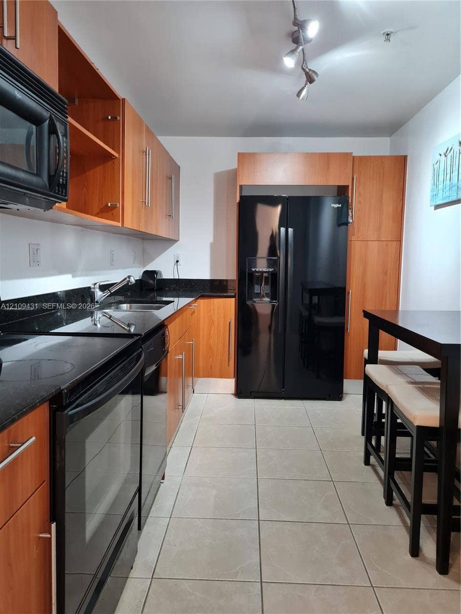 3001 S Ocean Drive, #619, Hollywood, Hollywood, FL 33019 Wood-finish flooring and large multi-pane windows providing natural light