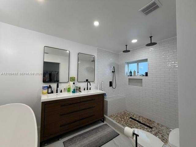 254 NW 107th Terrace, Coral Springs, FL 33071 Double vanity with rectangular vessel sinks, dark wood-finish cabinetry, walk-in shower with white subway tile surround, pebble-style flooring, and matte black fixtures