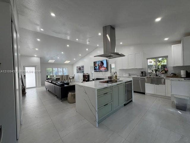 254 NW 107th Terrace, Coral Springs, FL 33071 Kitchen featuring a central island with a stone-finish waterfall countertop, stainless steel chimney-style range hood, recessed lighting, tile flooring, and vaulted ceiling