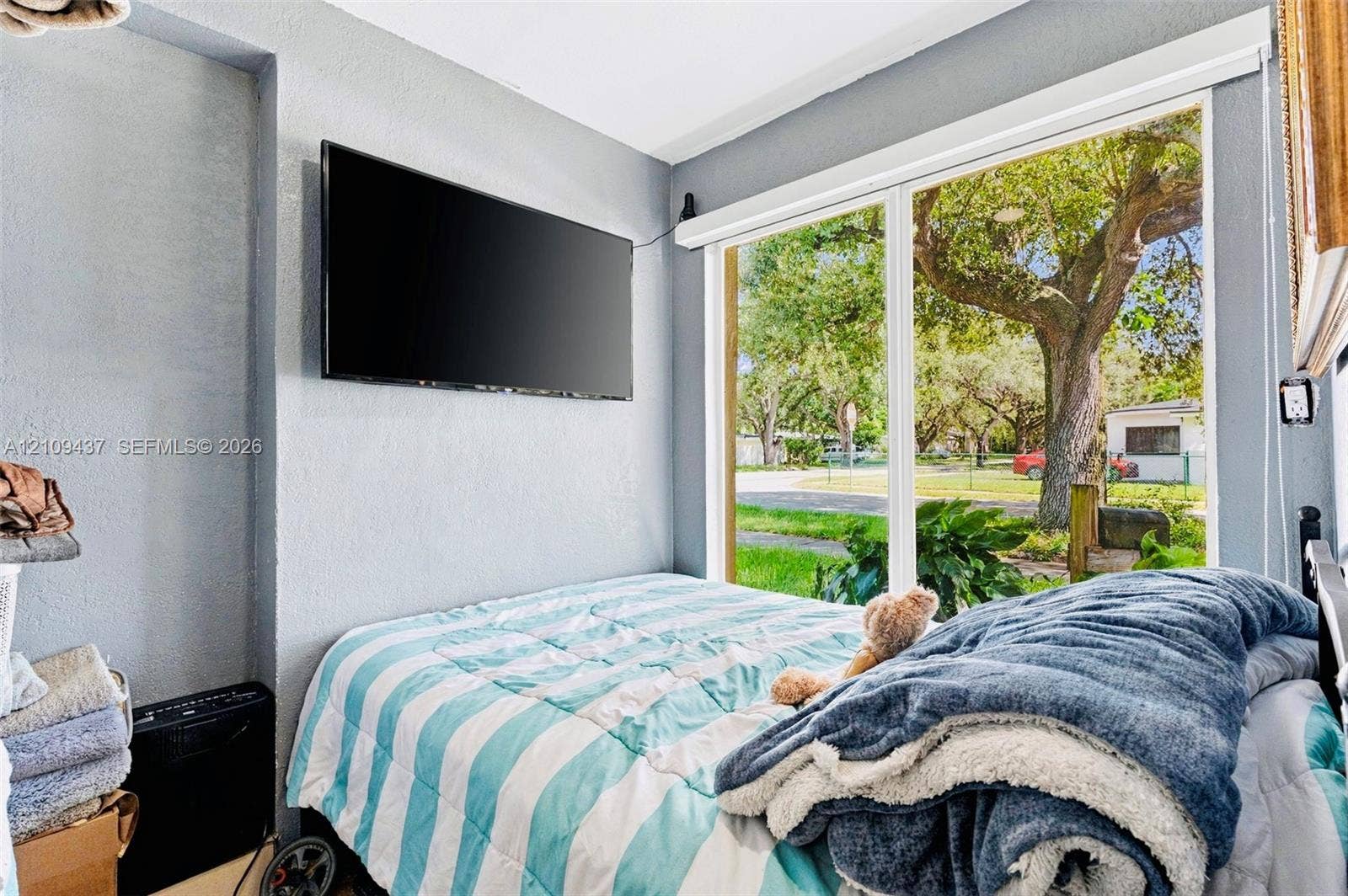 Large floor-to-ceiling window featuring exterior landscaping