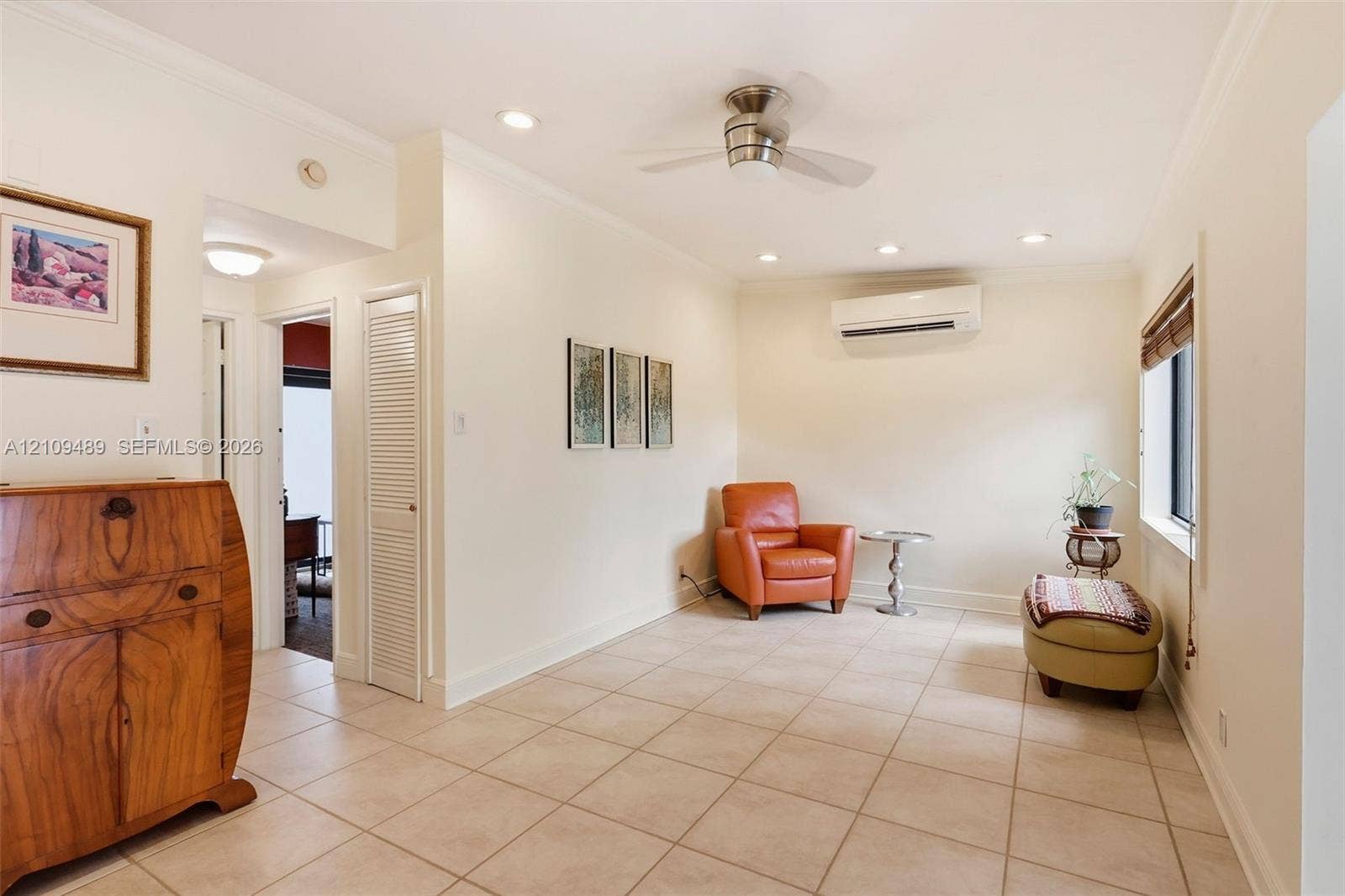 Fort Lauderdale, FL 33312 Ceramic tile flooring, recessed lighting, ceiling fan, and wall-mounted ductless air conditioning unit