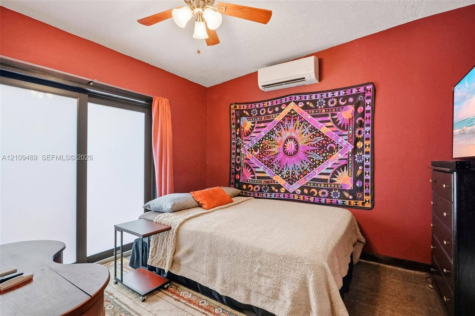 Fort Lauderdale, FL 33312 Room featuring a ceiling fan with integrated lighting, wall-mounted ductless air conditioning unit, and sliding glass door