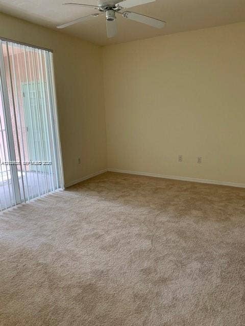 6804 W Sample Road, #6804, Coral Springs, Coral Springs, FL 33067 Interior room featuring wall-to-wall carpeting, a ceiling fan, and sliding glass doors with vertical blinds