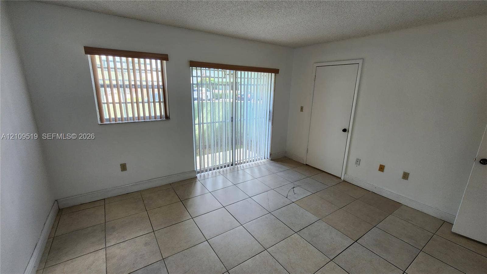 11081 NW 7th Street, #101-14, Miami, FL 33172 Primary bedroom with walk-in closet, (en-suite shower bathroom, linen closet) and private gated terrace.
