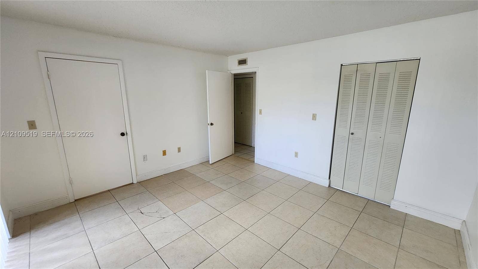 11081 NW 7th Street, #101-14, Miami, FL 33172 Primary bedroom with generous walk-in closet, (en-suite shower bathroom, linen closet) and private gated terrace.
