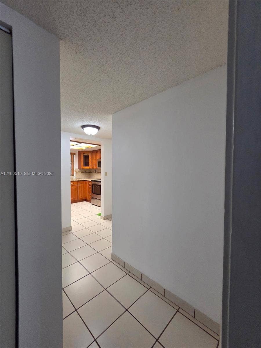 11081 NW 7th Street, #101-14, Miami, FL 33172 View from hallway to foyer entrance and kitchen
