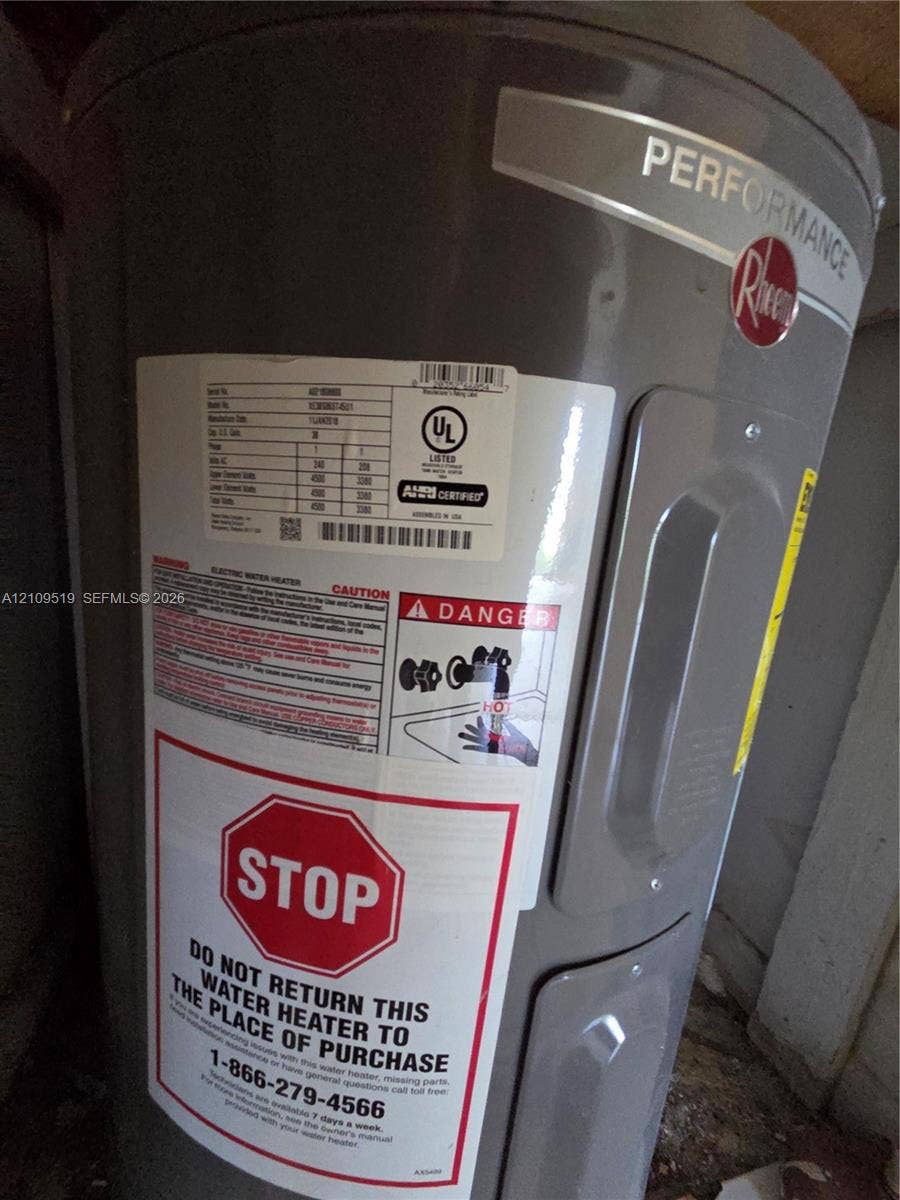 11081 NW 7th Street, #101-14, Miami, FL 33172 Rheem Performance electric water heater featuring a cylindrical steel tank design and factory-applied safety and identification labeling
