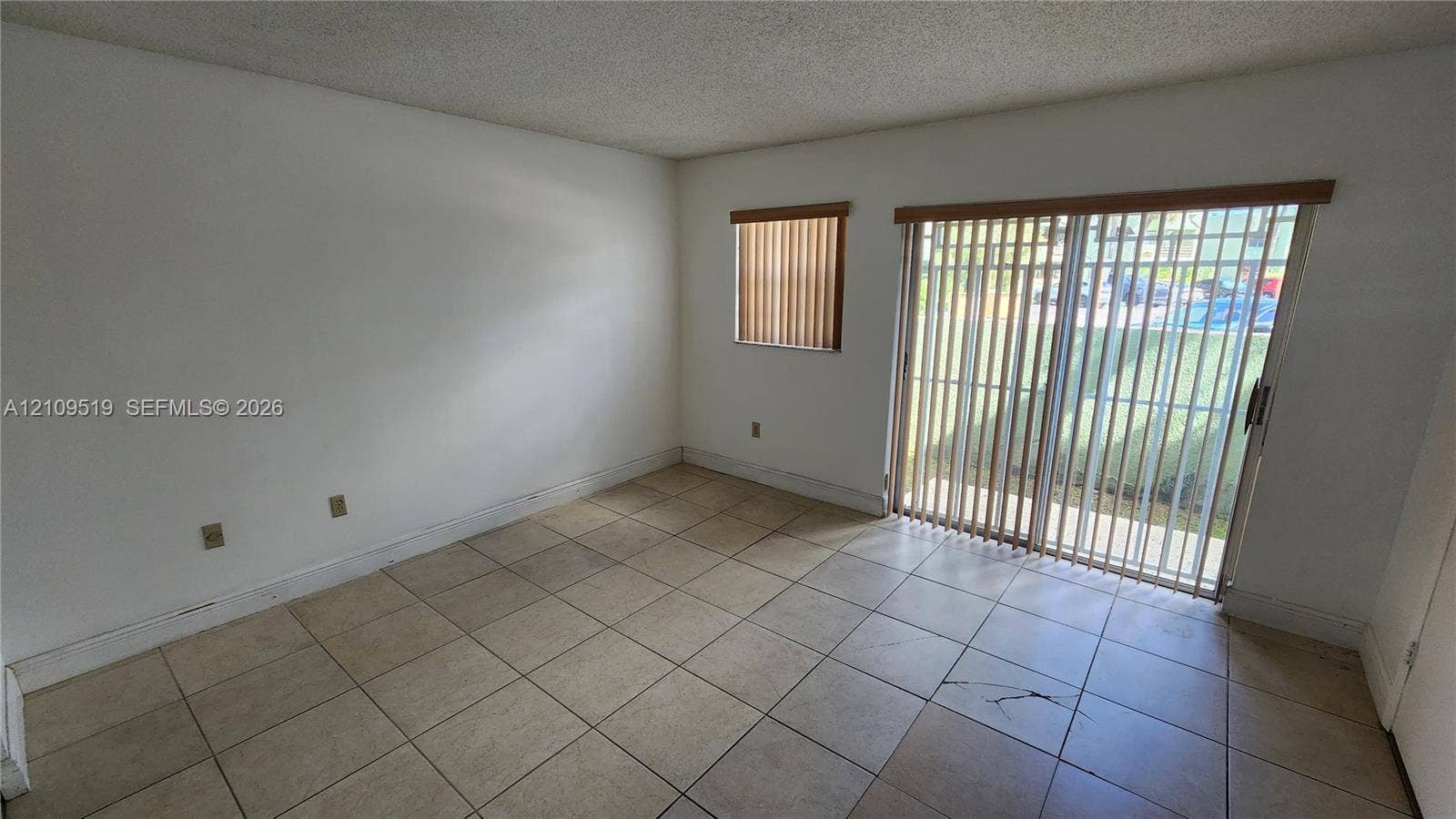 11081 NW 7th Street, #101-14, Miami, FL 33172 Primary bedroom with walk-in closet, (en-suite shower bathroom, linen closet) and private gated terrace..