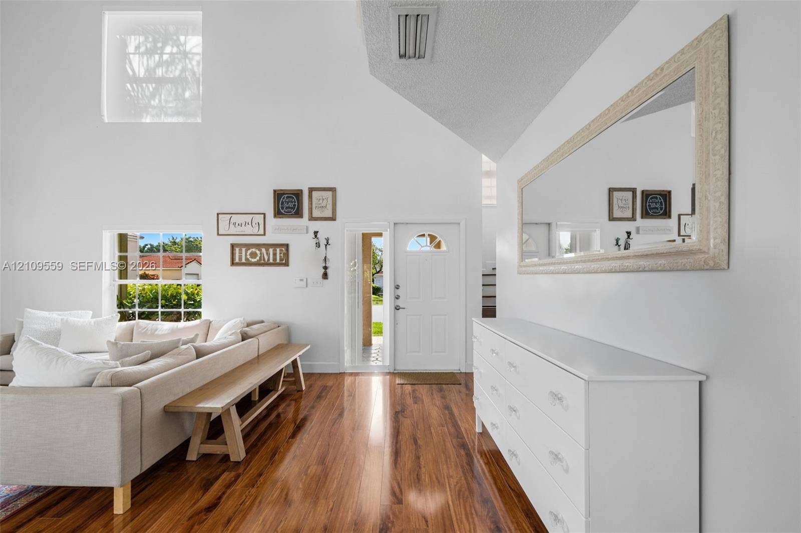 10217 NW 56th Street, Doral, FL 33178 Vaulted ceilings, wood-finish flooring, and natural light from multi-level windows