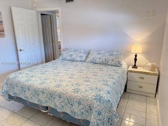 Room featuring neutral wall finishes, and tile flooring.