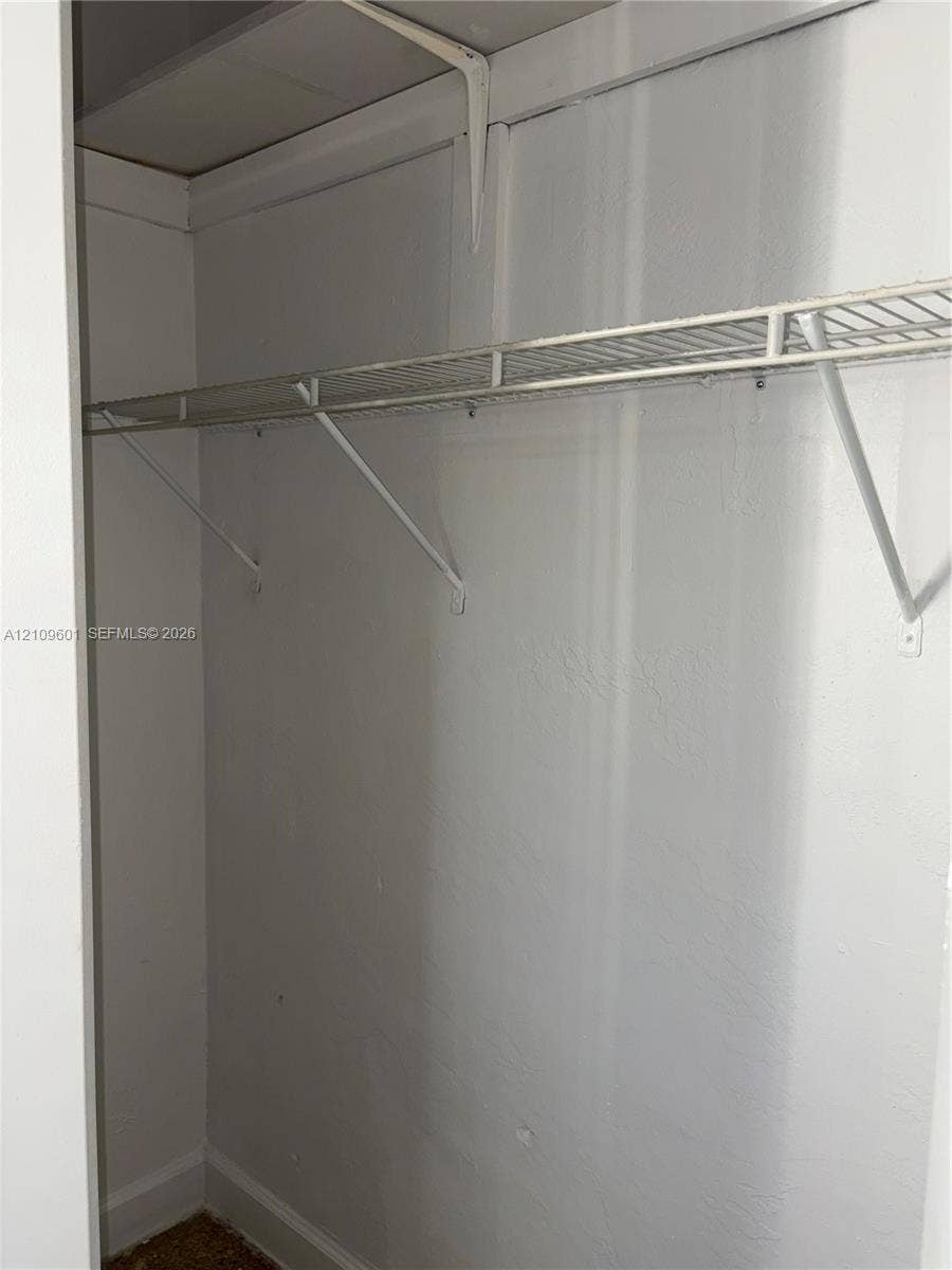 6320 Cleveland Street, Hollywood, Hollywood, FL 33024 Closet featuring upper and lower wire shelving with structural support brackets