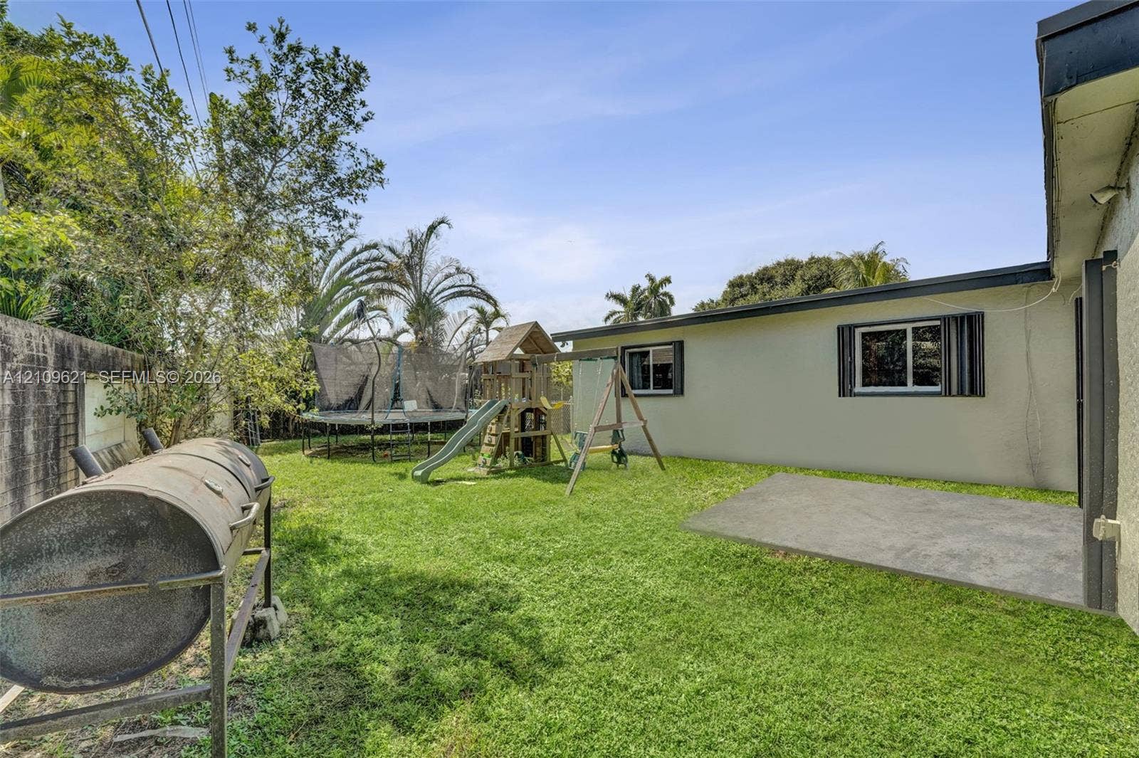 231 SW 64th Way, Pembroke Pines, FL 33023 Fenced backyard featuring a manicured lawn, concrete patio, and masonry perimeter wall