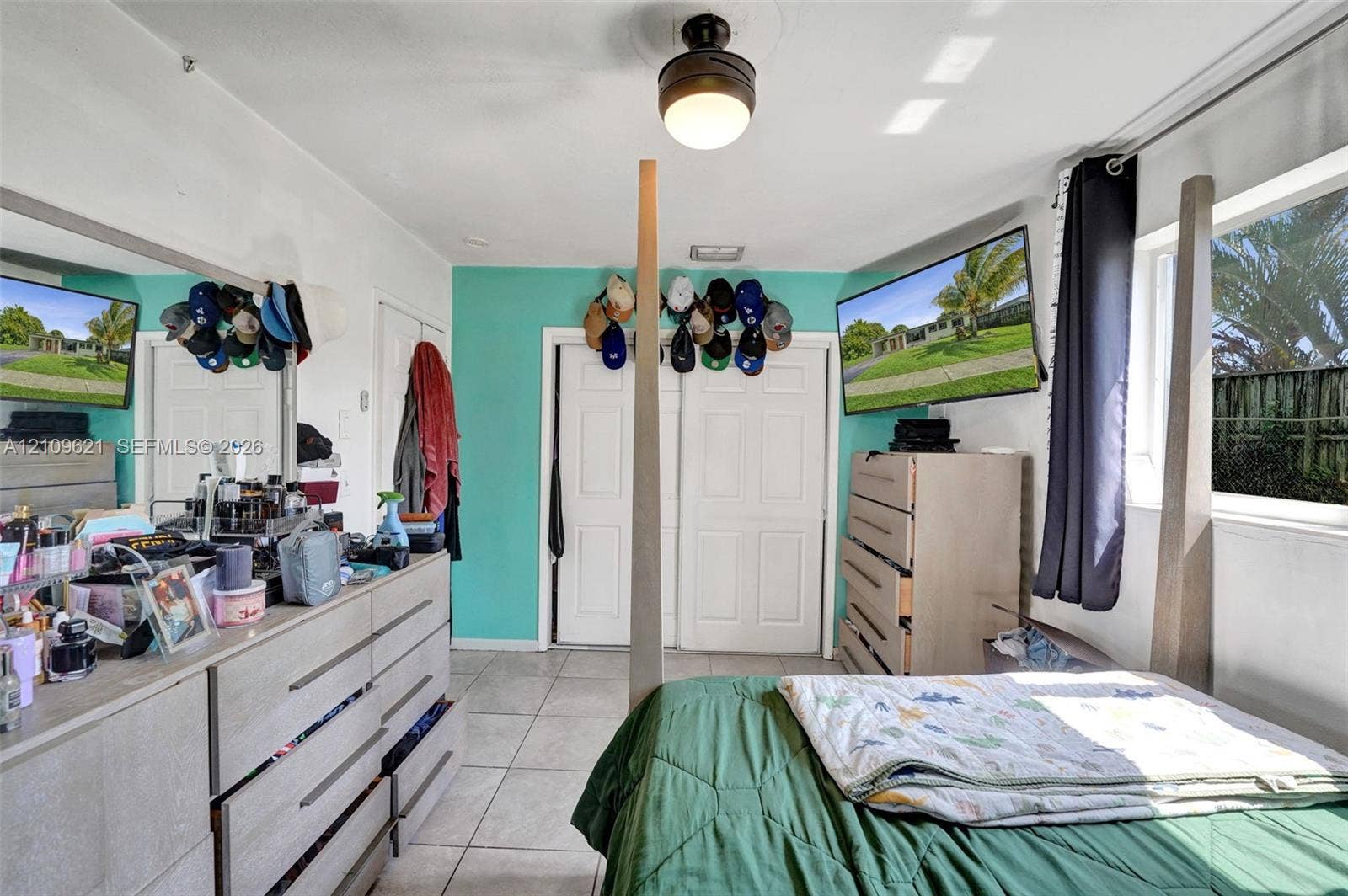 231 SW 64th Way, Pembroke Pines, FL 33023 Ceramic tile flooring, double-door reach-in closet, and flush-mount ceiling fixture with integrated fan
