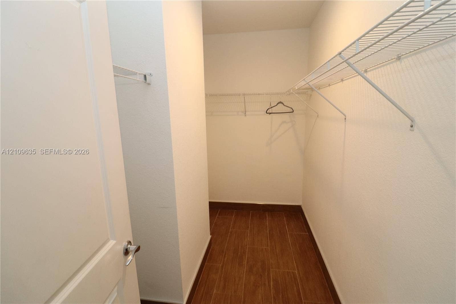 611 NE 28th Street, #1, Wilton Manors, Wilton Manors, FL 33334 Walk-in closet featuring wood-finish tile flooring and built-in metal shelving