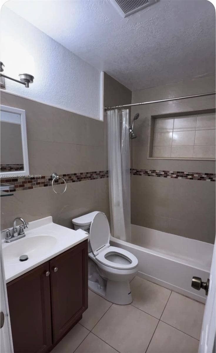 1881 SW 42nd Terrace, #2, Fort Lauderdale, Fort Lauderdale, FL 33317 Bathroom featuring tile flooring, vanity with white countertop, integrated shower niche, and decorative mosaic tile backsplash