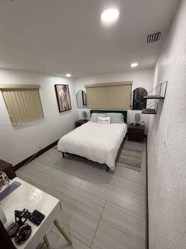 1881 SW 42nd Terrace, #2, Fort Lauderdale, Fort Lauderdale, FL 33317 Large-format tile flooring, recessed ceiling lighting, and vertical window blinds