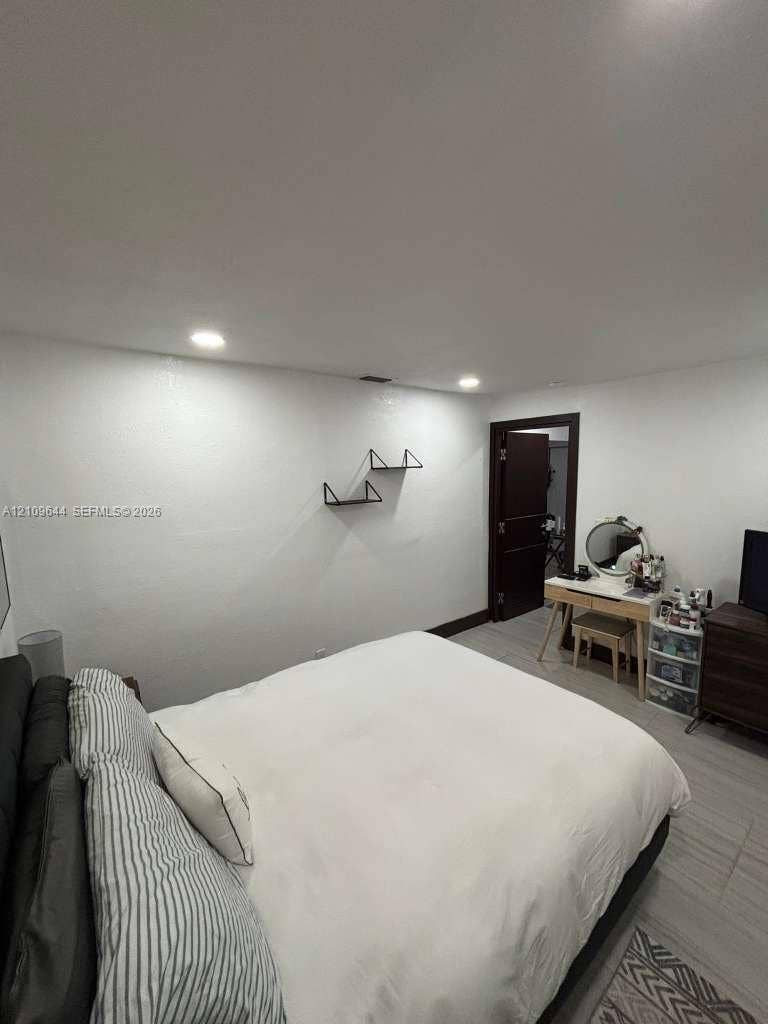 1881 SW 42nd Terrace, #2, Fort Lauderdale, Fort Lauderdale, FL 33317 Recessed lighting, light-toned wood-finish flooring, and two wall-mounted matte black floating shelves