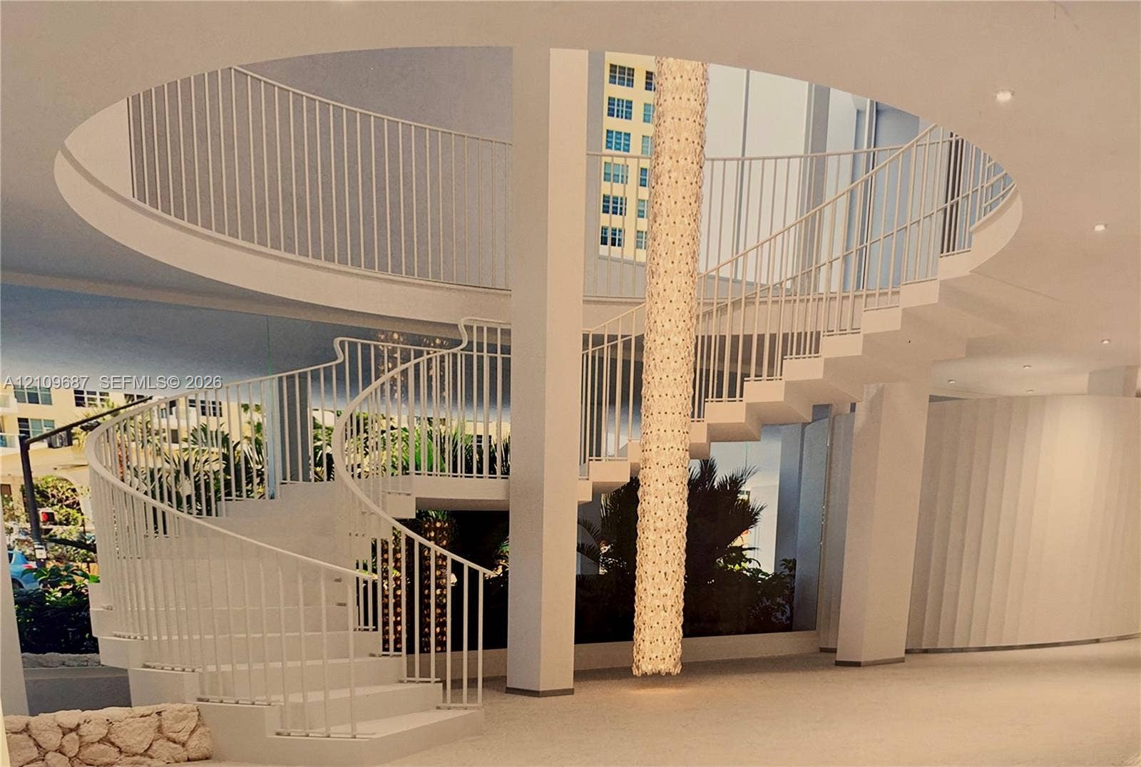 5555 Collins Avenue, #5C, Miami Beach, FL 33140 Architectural spiral staircase featuring white vertical railings, a central floor-to-ceiling light fixture, a circular mezzanine cutout, and recessed ceiling lighting