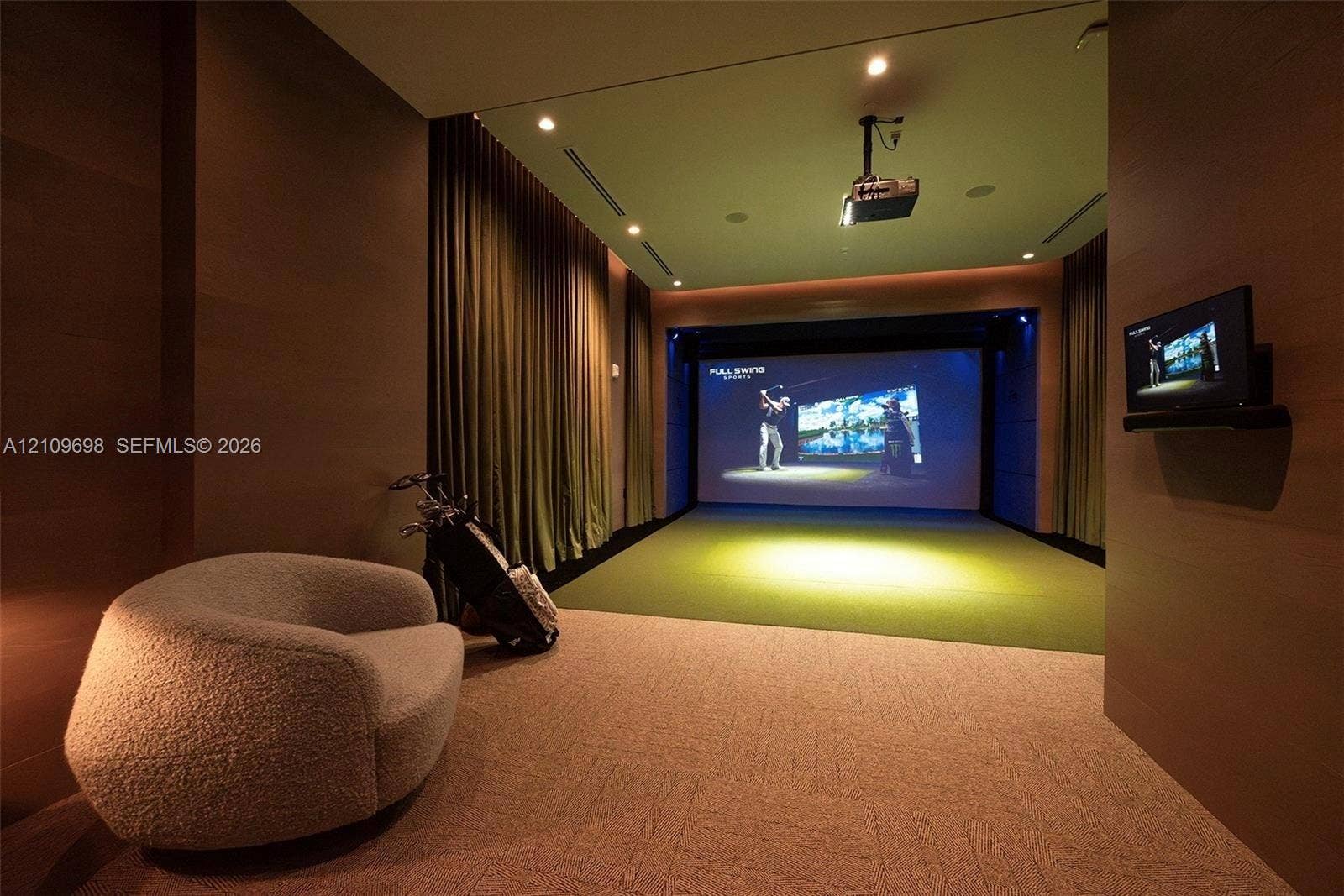 2411 Laguna Circle, #810, North Miami, FL 33181 Media room featuring a built-in projector system, large projection screen, wall-to-wall carpeting, recessed ceiling lighting, and floor-to-ceiling drapery
