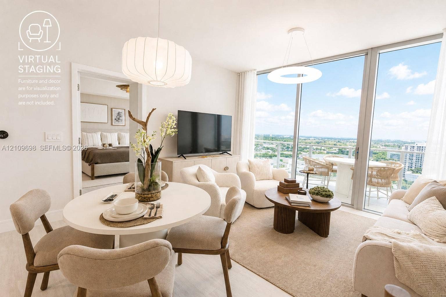 2411 Laguna Circle, #810, North Miami, FL 33181 Floor-to-ceiling glass windows, private balcony, wood-finish flooring, and modern pendant lighting
