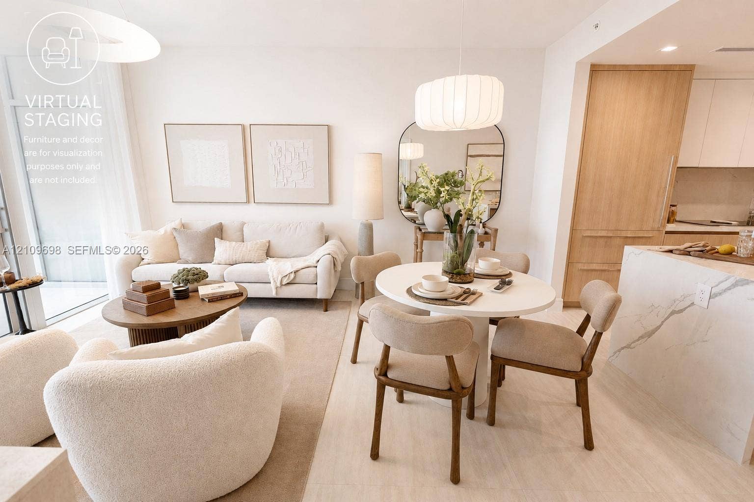 2411 Laguna Circle, #810, North Miami, FL 33181 Open-concept interior featuring light-toned wood-finish flooring, a waterfall-edge stone island, built-in floor-to-ceiling cabinetry, and modern pendant lighting