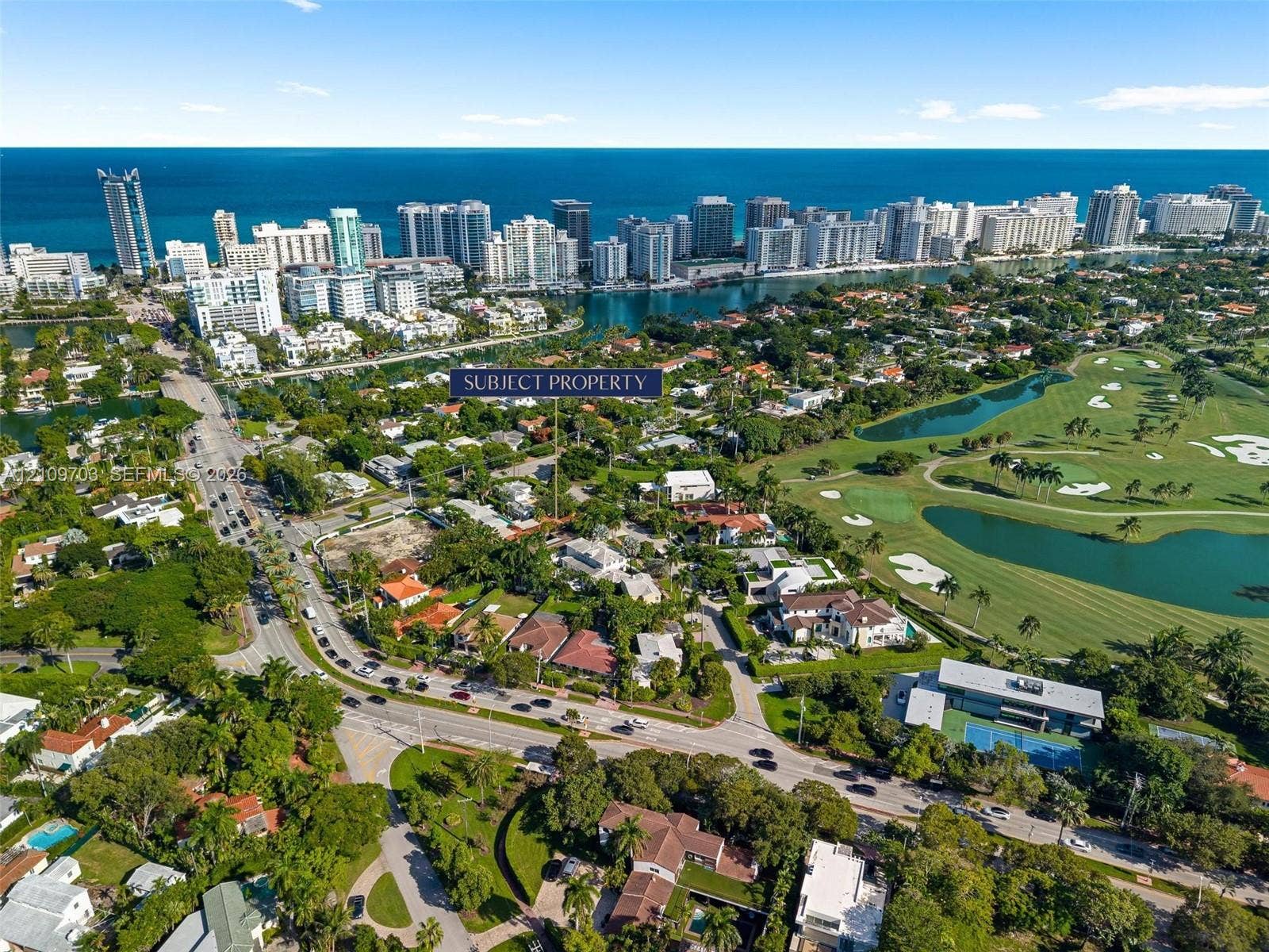 421 W 62nd Street, Miami Beach, FL 33140 Aerial perspective featuring proximity to coastal waterways, local golf course fairways, and mature tree-lined surroundings