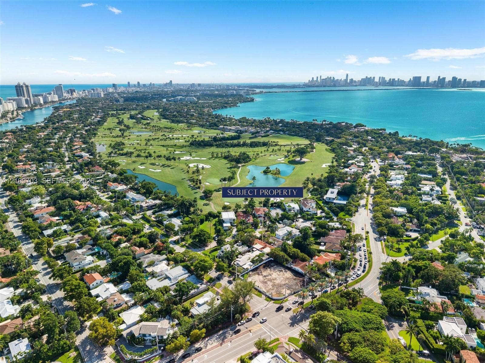421 W 62nd Street, Miami Beach, FL 33140 Aerial perspective of a corner lot situated in a coastal residential area, featuring proximity to a golf course and water frontage