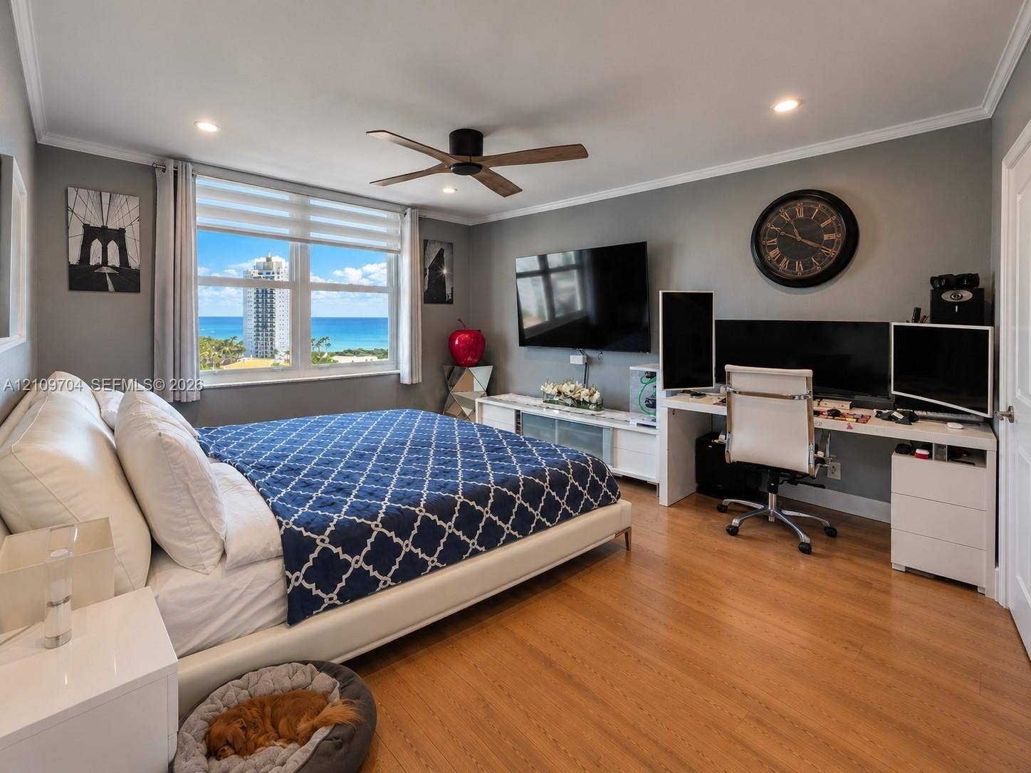 6770 Indian Creek Drive, #14C, Miami Beach, FL 33141 Room featuring wood-finish flooring, recessed lighting, a modern ceiling fan, and large windows with ocean and coastal scenery