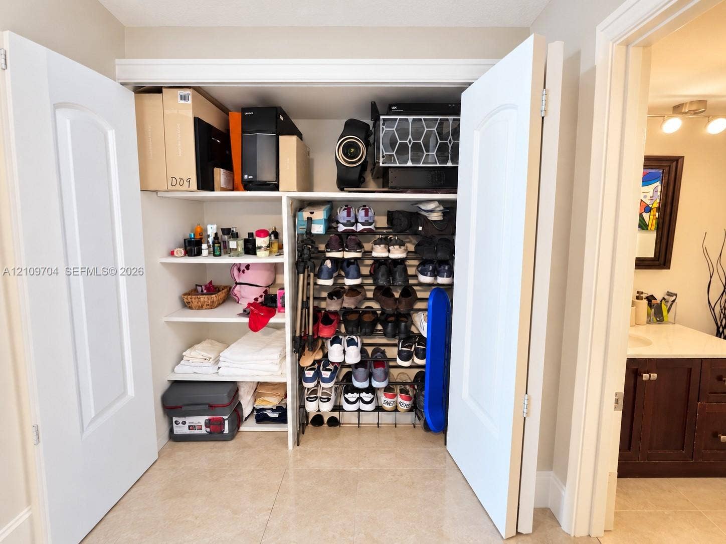 6770 Indian Creek Drive, #14C, Miami Beach, FL 33141 Closet featuring white paneled double doors and integrated white shelving
