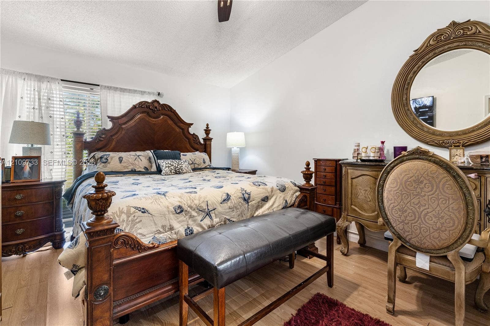 Wood-finish flooring, ceiling fan, and window blinds