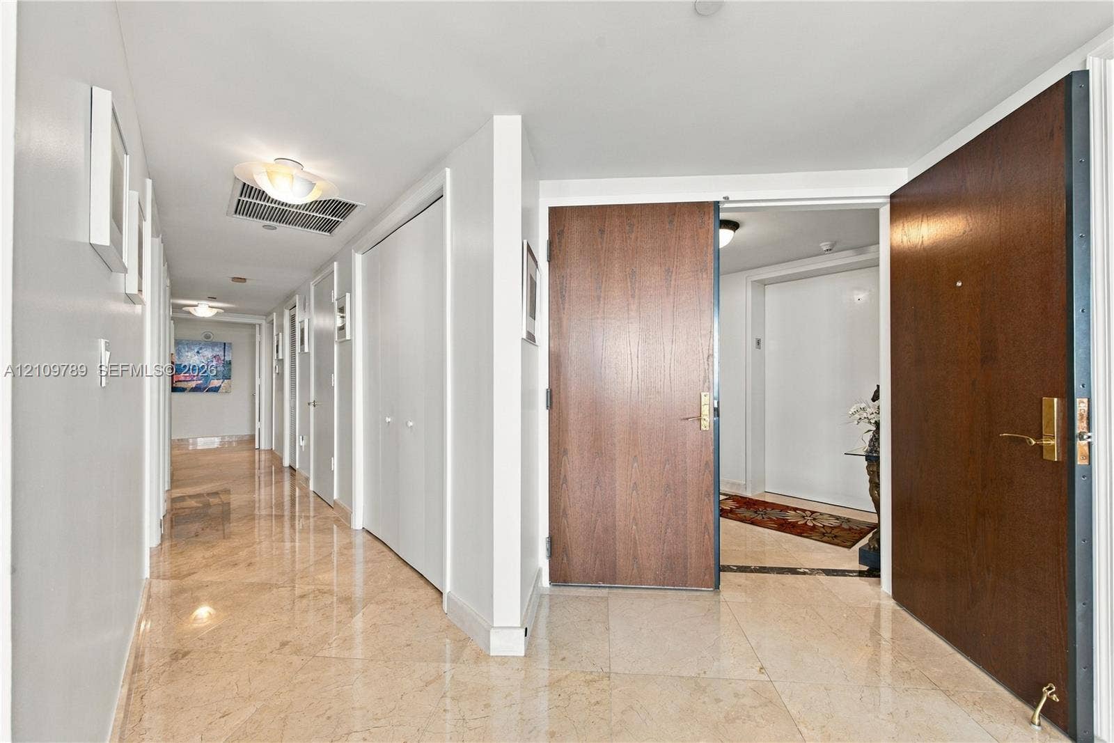 9595 Collins Avenue, #N6-B, Surfside, Surfside, FL 33154 Polished stone flooring, solid-core wood-finish entry doors