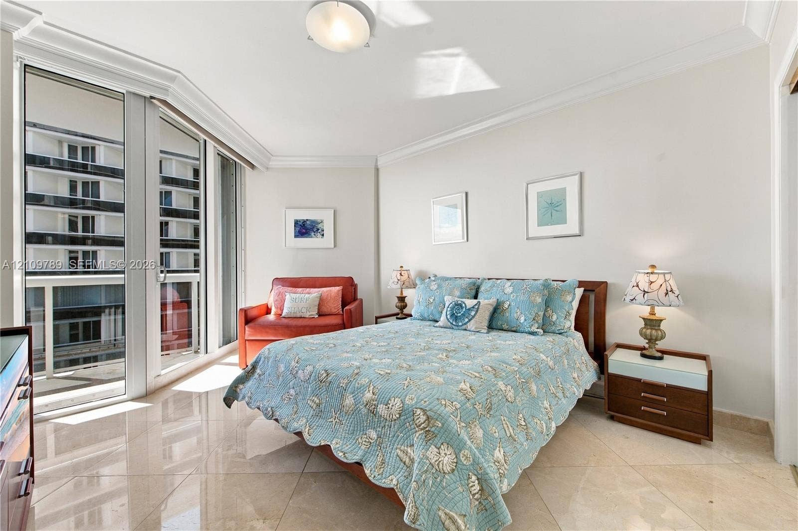9595 Collins Avenue, #N6-B, Surfside, Surfside, FL 33154 Floor-to-ceiling glass panel door, polished stone tile flooring, crown molding, and recessed ceiling lighting