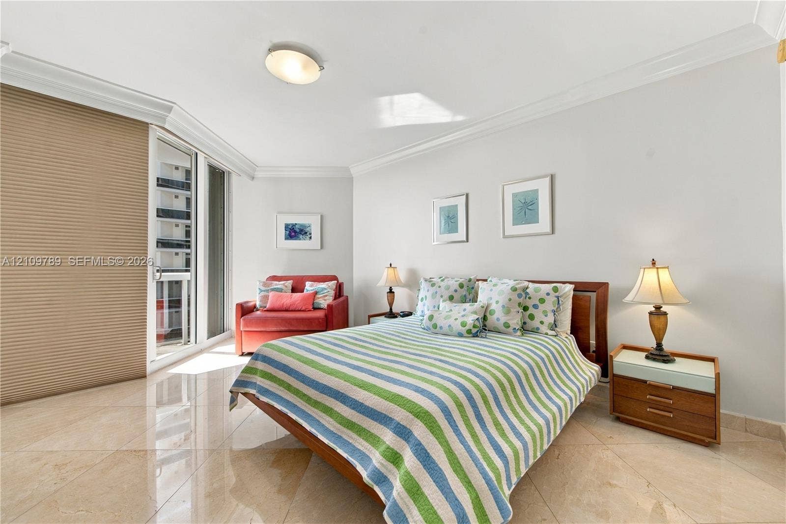 9595 Collins Avenue, #N6-B, Surfside, Surfside, FL 33154 Neutral stone-finish flooring, crown molding, floor-to-ceiling glass sliding door, and recessed ceiling lighting