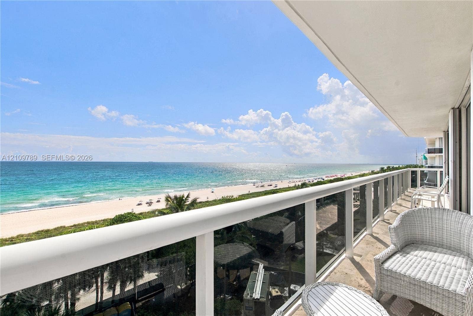 9595 Collins Avenue, #N6-B, Surfside, Surfside, FL 33154 Expansive balcony featuring a glass and white-railing enclosure, stone flooring, and unobstructed oceanfront scenery