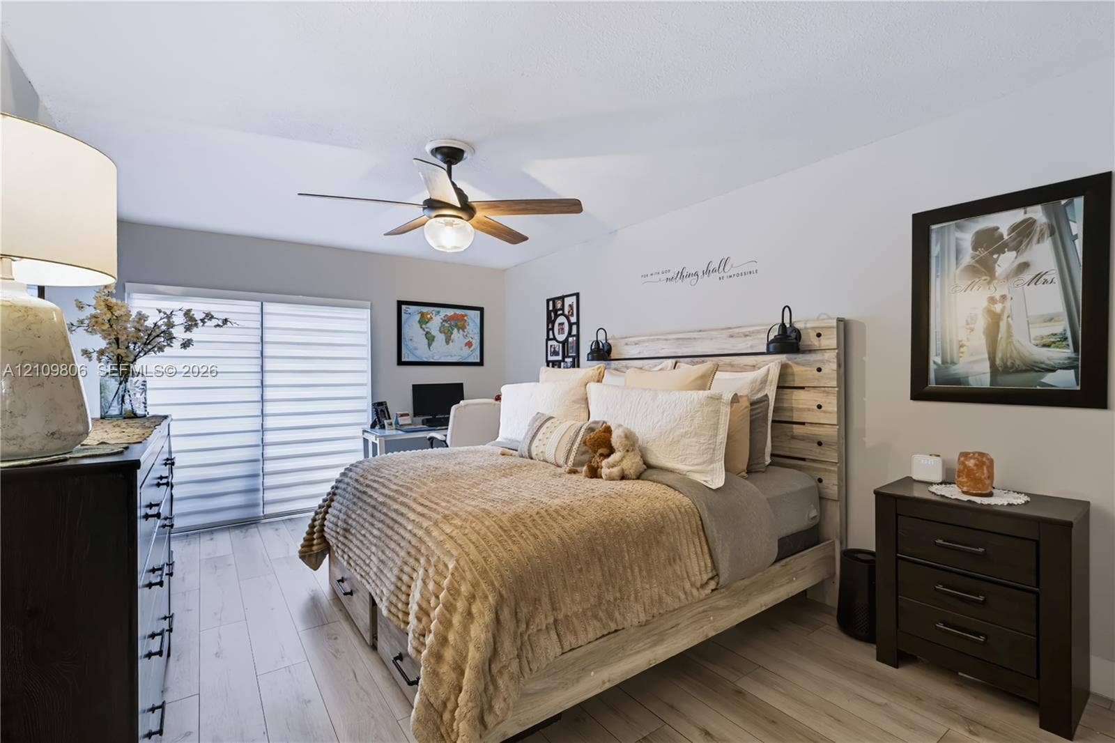 9123 SW 117th Court, Miami, FL 33186 Room featuring wood-finish flooring, a ceiling fan with integrated lighting, and horizontal sliding window blinds