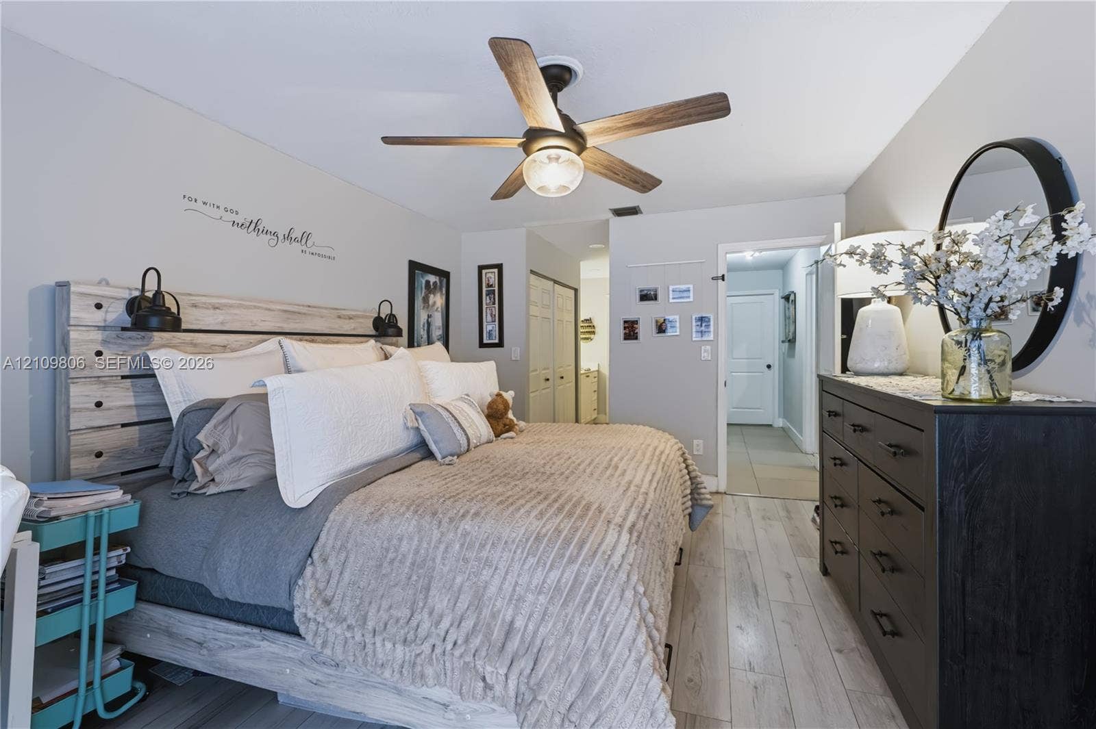 9123 SW 117th Court, Miami, FL 33186 Wood-finish flooring, ceiling fan with integrated lighting, and dual-door closet