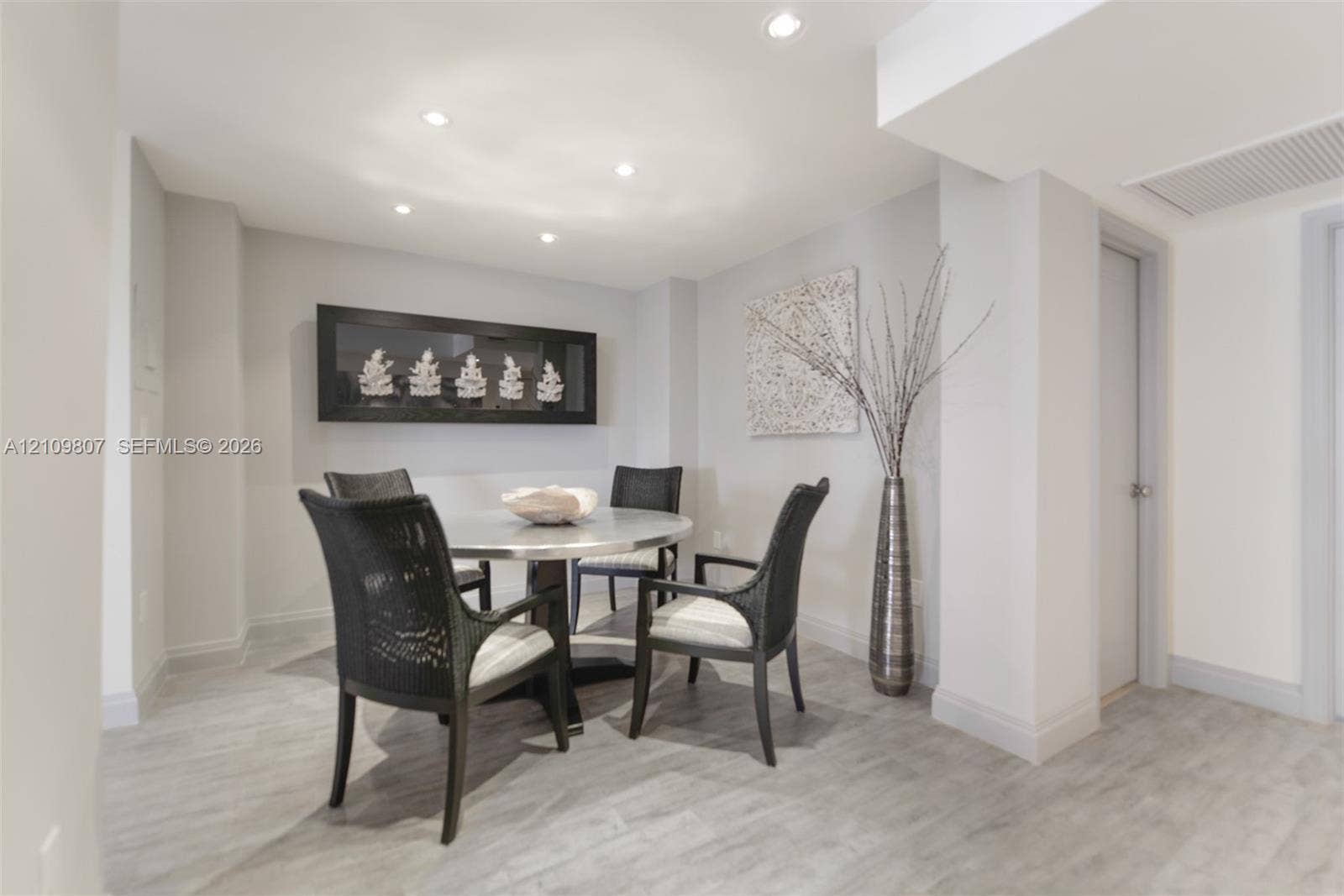 1980 S Ocean Drive, #16Q, Hallandale Beach, FL 33009 Neutral-toned space featuring recessed ceiling lighting, smooth-finish walls, and light wood-finish flooring