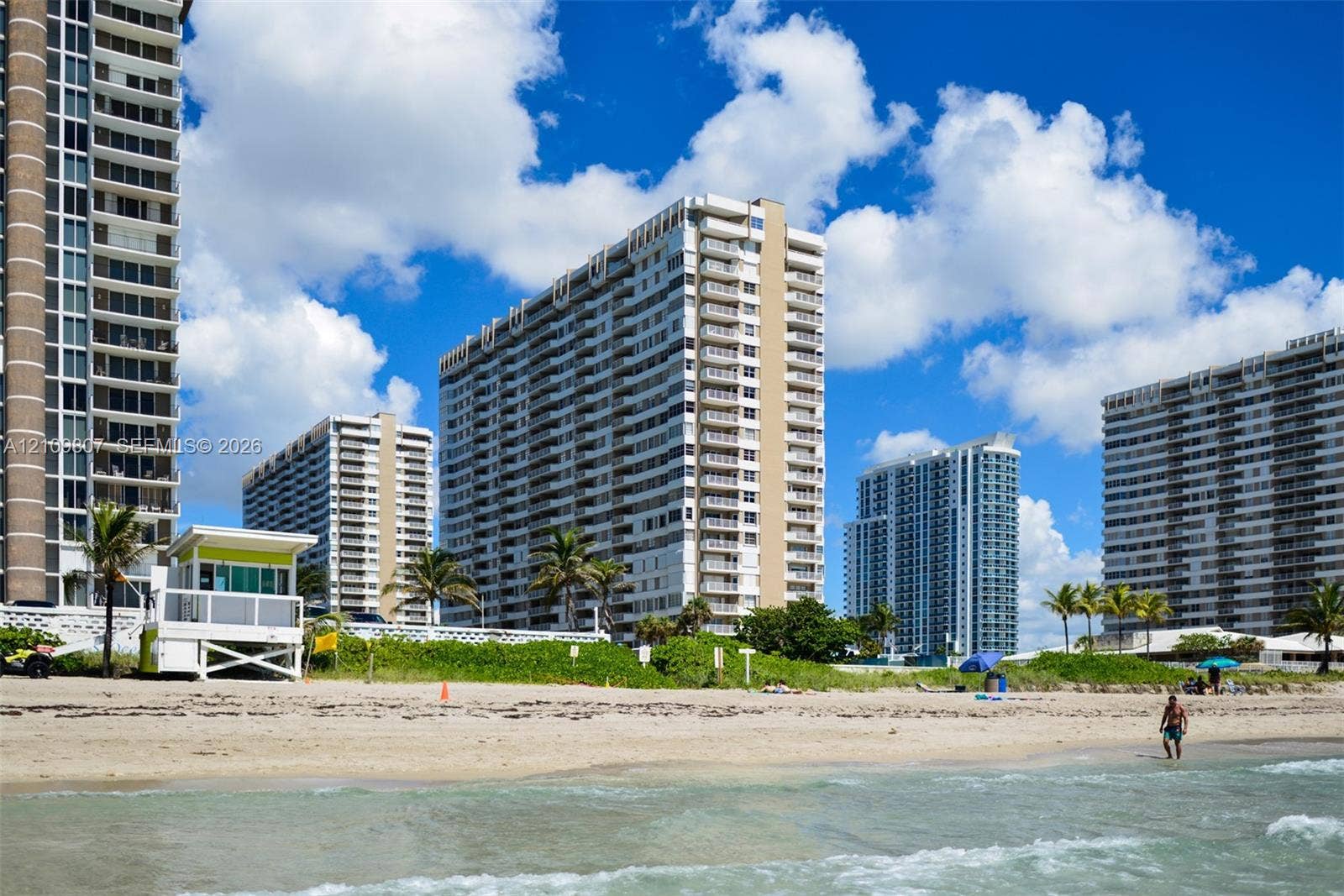 1980 S Ocean Drive, #16Q, Hallandale Beach, FL 33009 High-rise residential buildings featuring white exterior facades, private balconies, and direct access to sandy beachfront
