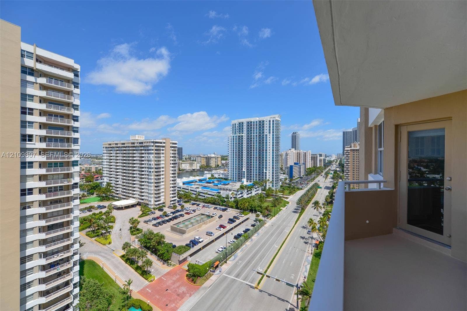 1980 S Ocean Drive, #16Q, Hallandale Beach, FL 33009 Private balcony featuring concrete flooring, a recessed ceiling, and a full-height glass-paneled entry door